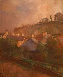 Häuser am Fuß einer Klippe